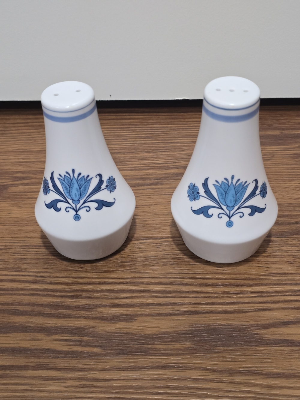 Noritake White Ceramic Salt and Pepper Shakers with Blue Floral Motif